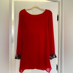 Red dress with rhinestone wrists. Zipper in the back.